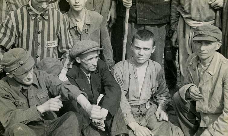 Survivors right after liberation. The man in the front row, right, has been identified as Robert Nardou.