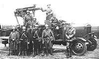 Teunis is the one sitting on the truck he is the second from the left.