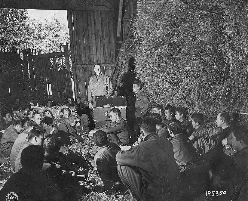 Chaplain Ray and Jack sitting in front of the improvised desk