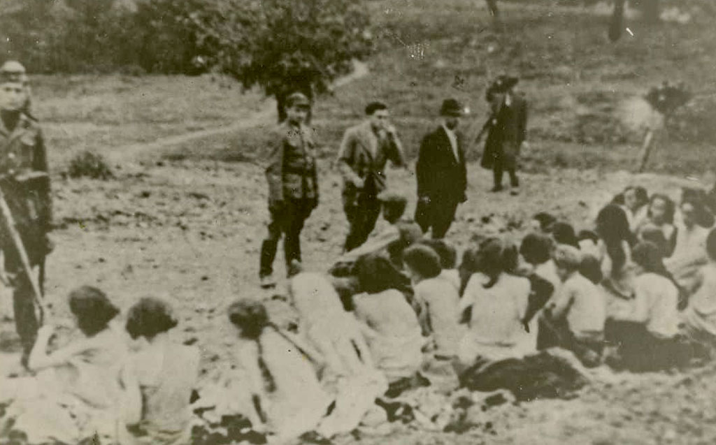 Jewish women and children are forced to undress before being executed