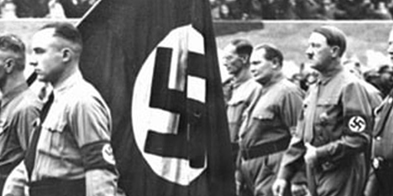 Adolf Hitler entering the Bürgerbräukeller shortly before declaring the start of the national revolution on 8 November 1923.