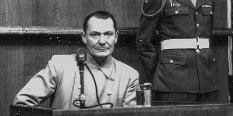Nazi Reichsmarschall Hermann Göring testifies in the witness box at the International Military Tribunal in Nuremberg, 1946.