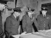 Air Vice-Marshal Ralph Cochrane, Wing Commander Guy Gibson, King George VI and Group Captain John Whitworth discussing the Dambuster Raid in May 1943