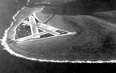 An aerial view of Midway Atoll showing its airfield before the Battle of Midway. The island's strategic location made it a key objective in Japan's attempt to eliminate American carrier forces.