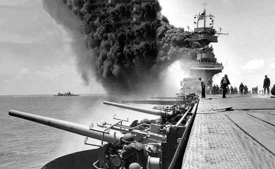 USS Yorktown comes under attack by Japanese aircraft during the Battle of Midway on 4 June 1942.