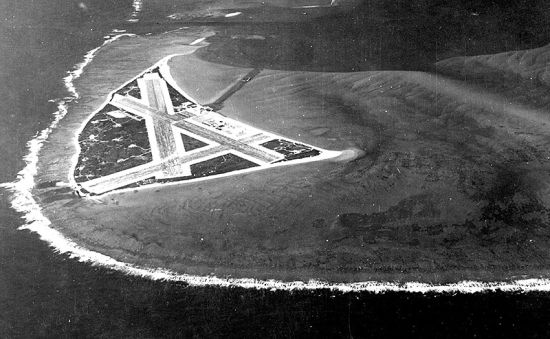 An aerial view of Midway Atoll showing its airfield before the Battle of Midway. The island's strategic location made it a key objective in Japan's attempt to eliminate American carrier forces.