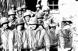 Men of M Company. Back row: Schraeder, Stoll and Hill. Middle row: Gwynn, Combs, Savage, Cook and Kliby. Front row: Jennigs, unknown, unknown and Priest.