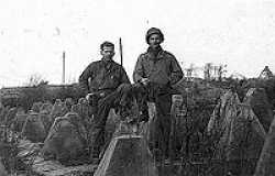 Walter (left) with his friend Sergeant Robert W. Fuhrman in the Siegfried Line, Western Germany around Christmas, 1944.