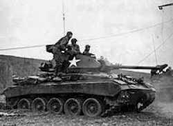 M-24 Chaffee, 743rd TB, firing on German positions Feb. 12th, 1945 across the Ruhr River in Germany