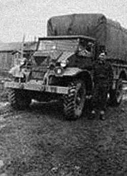 Camp Debert Nova Scotia. David Ward standing by his truck waiting for orders, 19 years old, 1941.