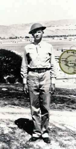 Basic training in California. Late summer 1942. We still had the World War I helmets at that time. The circle in the picture was my barracks.