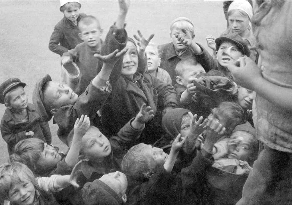 Russian children scramble for food, circa 1941.