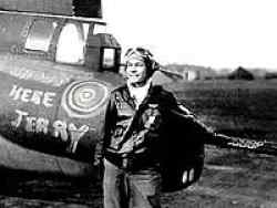 Gene posing in front of his B17 Flying Fortress. His arm rests on the twin .50 caliber machine gun, standard weapon on all U.S. Bombers. The artwork on the tail of the plane, "Shoot here Jerry" was done by Gene himself.