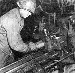 Above is a photograph of me as a "one man gun crew" in the Hurtgen Forest in November, 1944. During this period we would fire interdictory rounds at staggered times at suspected German positions and road junctions that they used. The gun would be set at a fixed deflection, altitude, and range. One of the crew (mostly it was I) would interupt whatever he was doing to go tom the gun, pick up a round, load it in the breach, close the breech, then jump over the right trail, grab the lanyard and fire the round!