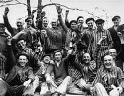 Happy and thankful prisoners of the Dachau concentration camp which the 45th Infantry Division liberated.