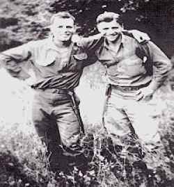 Corporal Jess Weiss & Sergeant Herbert Siegel on cliff above Omaha Beach, June 6, 1944.