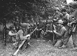 Marvin briefing for the men in Normandy prior to the St. Lo offensive