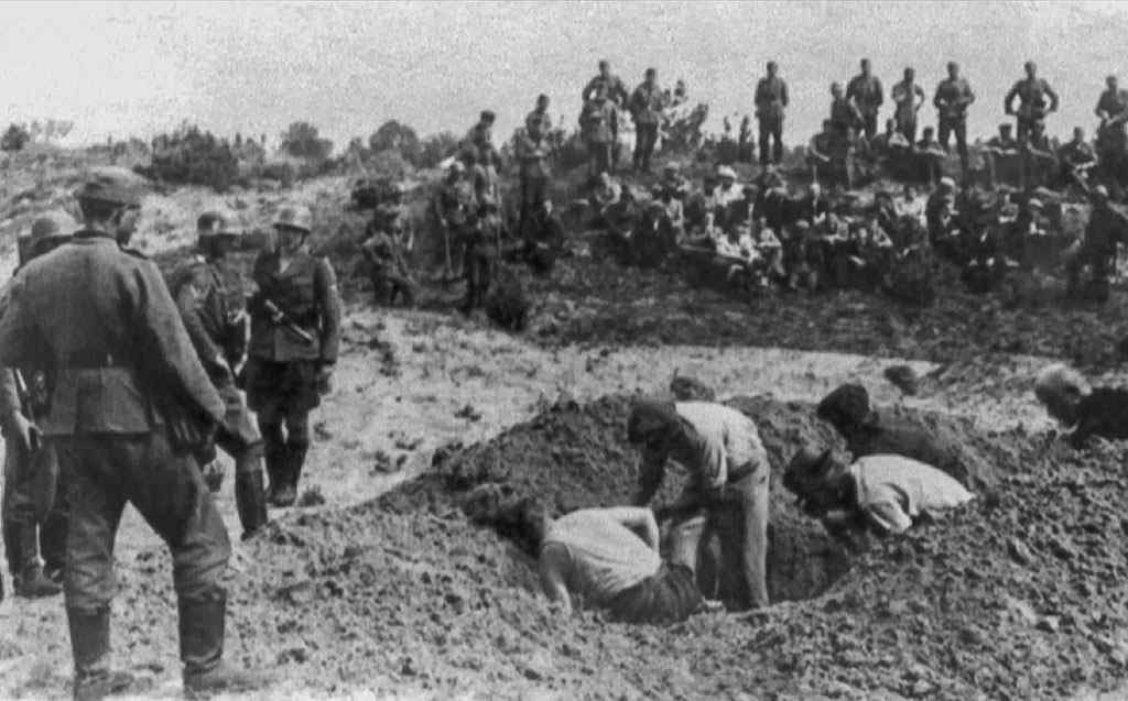 The condemned men were forced to dig their own graves before being killed.