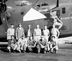Albert with his team in front of their plane.