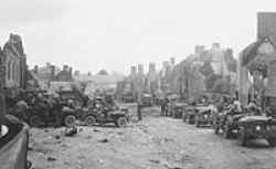 3rd Armored Division waiting to advance in St. Lo, Normandy, France.