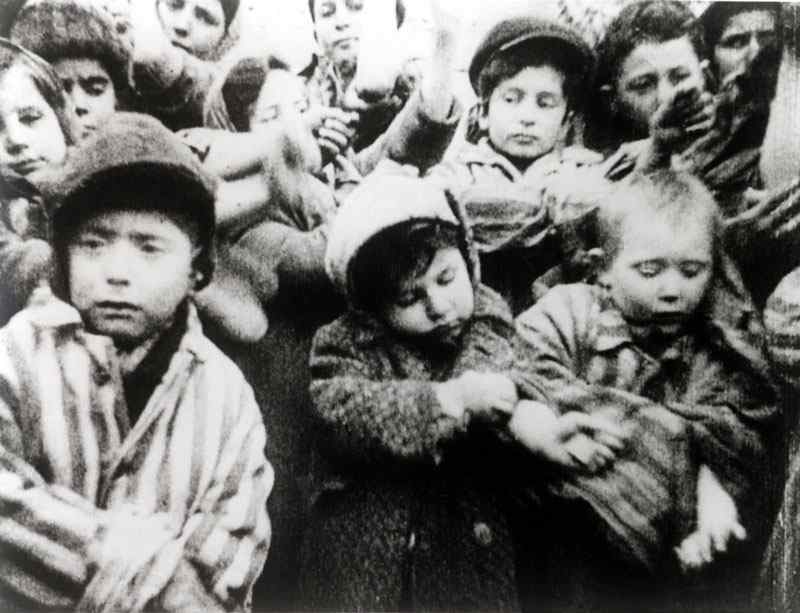 Children showing their tattoos after liberation in 1945