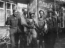 Denzil W. Space, Unknown, Merle B. Lauer, John Obergoss and Paul Miller in Berchtesgaden. People were not allowed to fish in Hitler's private lake, these medics were thus able to catch 67 trouts in 1 hour with only surgical needles!
