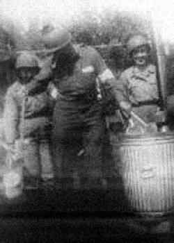 Washing mess kits after chow in Normandy