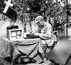 John Bender busy typing in the field.