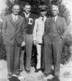 Left to right in this photo is his uncle"Doc" Macon, his 1st cousin, LeRoy Collis Macon (who was killed on Guam on 22 July 1944), Bunny Wayne Chambers, and his Dad, Bun Chambers.