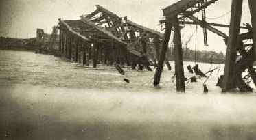 The Germans blew up bridges to stop the Allied advance. John and his mates would soon clear it up and build Bailey bridges