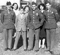 Showing off uniforms for the family. Back row from left: Sisters Pauline, Louise, and Francis. Front row from left: Andrew, Drennan, Walter, and Hogan..