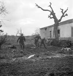 Riflemen of the 48th Highlanders of Canada take cover during German counterattack north of San Leonardo, 10 December 1943.