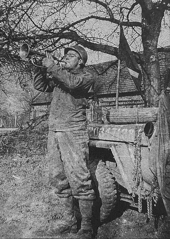 Jack G. Ammon, Chaplains assistant to Chaplain David W. Ray playing Taps on his bugle