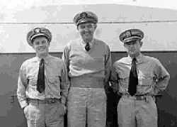 The officers of the USLCGL 687: (Left) Ensign D. A. Glover (Right) Ensign E. B. Murray (Center) Lieutenant Bob Coop
