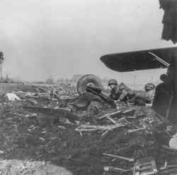 Owen suffered a fatal gunshot wound to the neck, passing away in the embrace of his friend, Edward Hurrell. The poignant moment was captured by war photographer Jimmy Christie, who coincidentally happened to be aboard my uncle's glider. In the photograph, Owen, my uncle, gazes directly at the camera, with Edward positioned to his right. Regrettably, the identity of the soldier in the foreground remains unknown to me.