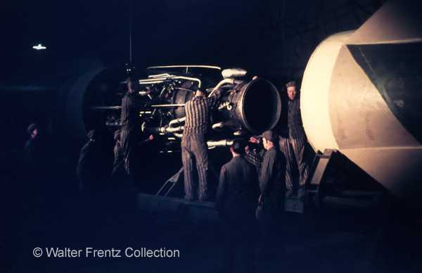 Prisoners assembling the tail part and engine of a V2 rocket.