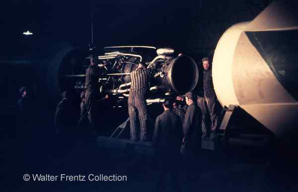 Prisoners assembling the tail part and engine of a V2 rocket.