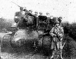 John Ausland in front of the M-7 in Germany. John did not serve as a cannoneer on an M-7. His duties were mostly as a forward observer who spent most of his time in combat up front with the infantry. He evidently had somebody take a picture of him in front of that M-7 to show people the type of weapons to which he was sending fire command directions.