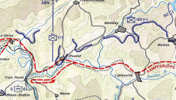 The area of operations of Task Force Hansen in December 1944. The German line of attack is shown in red; American units, in blue, represent the situation around 20 December after reinforcements had moved into place.