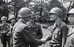 Dan in June 1945 receiving the Bronze Star from Brigadier General James M Lewis in Oelsnitz, Germany