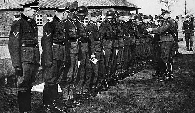 Commandant Max Pauly handing out medals